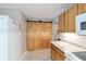 Eat-in kitchen with a full pantry, marble countertop, and white appliances at 208 Se 32Nd Ave, Ocala, FL 34471
