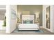 Calm bedroom with soft lighting, two bedside lamps, and decoratively-placed throw pillows at 5048 Barnet Dr, Davenport, FL 33837