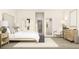 Stylish bedroom featuring modern furniture, neutral tones, artwork, and a comfortable seating area at 5048 Barnet Dr, Davenport, FL 33837