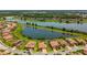 An aerial view showcases houses with lake views and access to other community amenities at 1839 Via Lago Dr, Lakeland, FL 33810