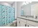 Bathroom featuring a mermaid shower curtain, vanity with granite countertop, and tiled floor at 1839 Via Lago Dr, Lakeland, FL 33810