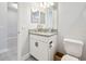 Bright bathroom featuring granite countertop vanity with storage and a neutral color scheme at 1839 Via Lago Dr, Lakeland, FL 33810