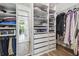 Walk-in closet with custom shelving provides ample storage for clothing, shoes, and accessories at 1839 Via Lago Dr, Lakeland, FL 33810