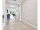 Bright foyer with neutral walls, ceramic tile flooring, and an open view into the living area at 1839 Via Lago Dr, Lakeland, FL 33810