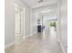 Bright foyer with neutral walls, ceramic tile flooring, and an open view into the living area at 1839 Via Lago Dr, Lakeland, FL 33810
