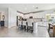 Kitchen featuring white cabinets, stainless steel appliances, a center island, and tile flooring at 1839 Via Lago Dr, Lakeland, FL 33810
