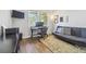 Inviting office space with a futon, modern desk setup, and natural light from the windows at 1839 Via Lago Dr, Lakeland, FL 33810