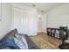 Modern office area featuring a futon, large closet, and functional bookcase storage at 1839 Via Lago Dr, Lakeland, FL 33810
