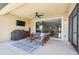 Stylish screened-in patio furnished with comfortable seating and an outdoor grilling area at 1839 Via Lago Dr, Lakeland, FL 33810