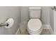 Close-up of a white toilet with a roll of toilet paper to the left at 1839 Via Lago Dr, Lakeland, FL 33810