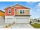 Charming two-story home featuring a two-car garage and colorful, eye-catching design at 3762 King Hill Dr, Haines City, FL 33844