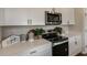 Bright kitchen showcasing modern appliances, sleek countertops, and stylish decorative accents at 3762 King Hill Dr, Haines City, FL 33844