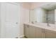 The bathroom has a double sink vanity with a large mirror and modern finishes at 3782 King Hill Dr, Haines City, FL 33844