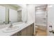 This bathroom offers a double sink vanity, with modern finishes, and a shower-tub combination at 3782 King Hill Dr, Haines City, FL 33844