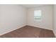 This bedroom is bright, with neutral carpet and a window providing natural light at 3782 King Hill Dr, Haines City, FL 33844