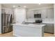 Modern kitchen with stainless steel appliances and a spacious center island at 3782 King Hill Dr, Haines City, FL 33844