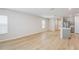 Bright living room with hardwood floors and a view into the modern kitchen at 3782 King Hill Dr, Haines City, FL 33844