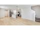 Open concept kitchen and living room featuring hardwood floors and stainless steel appliances at 3782 King Hill Dr, Haines City, FL 33844