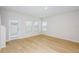 Bright living room with hardwood floors and windows, offering natural light at 3782 King Hill Dr, Haines City, FL 33844