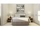 Calm bedroom with minimalist decor, soft lighting, and a comfortable bed at 5431 Lewisham Dr, Davenport, FL 33837