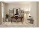 Bright home office with built-in shelving, a modern desk, and comfortable seating at 5431 Lewisham Dr, Davenport, FL 33837