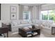 Bright living room features an oversized sectional sofa and plenty of natural light at 1829 Fulfillment Dr, Kissimmee, FL 34744
