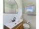 Updated bathroom with modern vanity, sleek mirror, and contemporary white tile at 211 W Crescent Dr, Lakeland, FL 33805