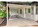 Covered carport featuring two doors, providing ample space for parking and storage at 211 W Crescent Dr, Lakeland, FL 33805