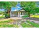 Charming single-Gathering home featuring a carport and an inviting screened-in front porch at 211 W Crescent Dr, Lakeland, FL 33805