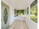 Inviting screened porch with tile flooring, perfect for enjoying the outdoors at 211 W Crescent Dr, Lakeland, FL 33805