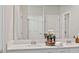 Double sink vanity in a modern bathroom with mirrors and lighting at 2437 Spring Tune Aly, Kissimmee, FL 34744