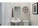 This bathroom has a modern sink and a mirror with decoration at 2437 Spring Tune Aly, Kissimmee, FL 34744