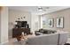 Comfortable living room with stylish furnishings, soft rug and neutral color palette at 2437 Spring Tune Aly, Kissimmee, FL 34744