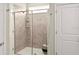 Walk-in shower with tiled walls, glass door, and built-in niche at 2437 Spring Tune Aly, Kissimmee, FL 34744