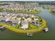 Sprawling aerial view of a lakeside community featuring waterfront homes, boat docks, and lush landscaping at 4950 Chase Ct, St Cloud, FL 34772