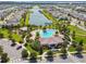 Aerial view of community with playground, pool and lake offering many choices for Gathering fun at 4950 Chase Ct, St Cloud, FL 34772