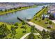 Aerial view of a neighborhood featuring a boat ramp leading to a large lake at 4950 Chase Ct, St Cloud, FL 34772
