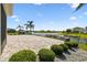 Expansive backyard with brick patio, lush landscaping, and serene lake views create an outdoor oasis at 4950 Chase Ct, St Cloud, FL 34772