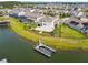 Stunning backyard features a boat dock, spacious patio and lush landscaping with lake views at 4950 Chase Ct, St Cloud, FL 34772