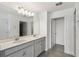 Bathroom featuring double vanity with white countertop and gray cabinets at 4950 Chase Ct, St Cloud, FL 34772