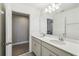Bathroom featuring a double vanity with white countertops and modern fixtures, offering ample space at 4950 Chase Ct, St Cloud, FL 34772