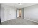 Neutral bedroom with carpet, featuring a double door closet, offers ample space and storage at 4950 Chase Ct, St Cloud, FL 34772
