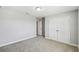 Empty bedroom featuring a large closet and neutral colored carpet at 4950 Chase Ct, St Cloud, FL 34772