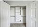 Well-organized closet with shelving, drawers, and rods for optimal storage and easy organization at 4950 Chase Ct, St Cloud, FL 34772