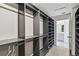 Open view of walk-in closet leading to a bathroom at 4950 Chase Ct, St Cloud, FL 34772