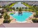 A resort style pool with colorful splash pad and relaxing lounge chairs in the community at 4950 Chase Ct, St Cloud, FL 34772