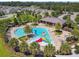 A full aerial of the community pool, clubhouse, playground, and splash pad at 4950 Chase Ct, St Cloud, FL 34772
