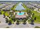 Aerial shot of the community pool featuring a clubhouse, splash pad, and ample lounging space at 4950 Chase Ct, St Cloud, FL 34772