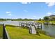 Lakeside dock with boat lift offers convenient access to water activities and scenic views of the community at 4950 Chase Ct, St Cloud, FL 34772