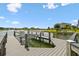 Private boat dock with boat lift offers convenient water access, perfect for boating enthusiasts and lakefront living at 4950 Chase Ct, St Cloud, FL 34772
